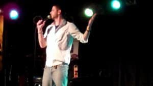 Comedian performing stand-up while developing their comedic voice